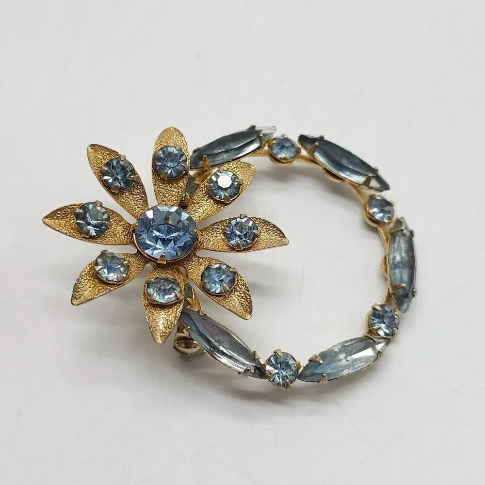 Vintage Gold Tone Brooch With Blue Rhinestones In Floral Design